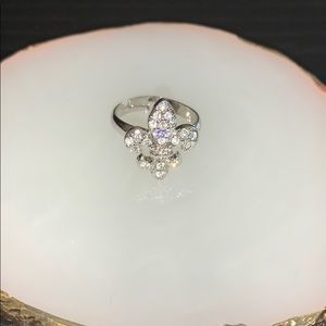 Adjustable silver fleur de lis ring with gemstones